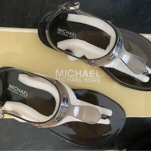 Michael Kors T-strap metal plate MK brand new in box. Never worn.